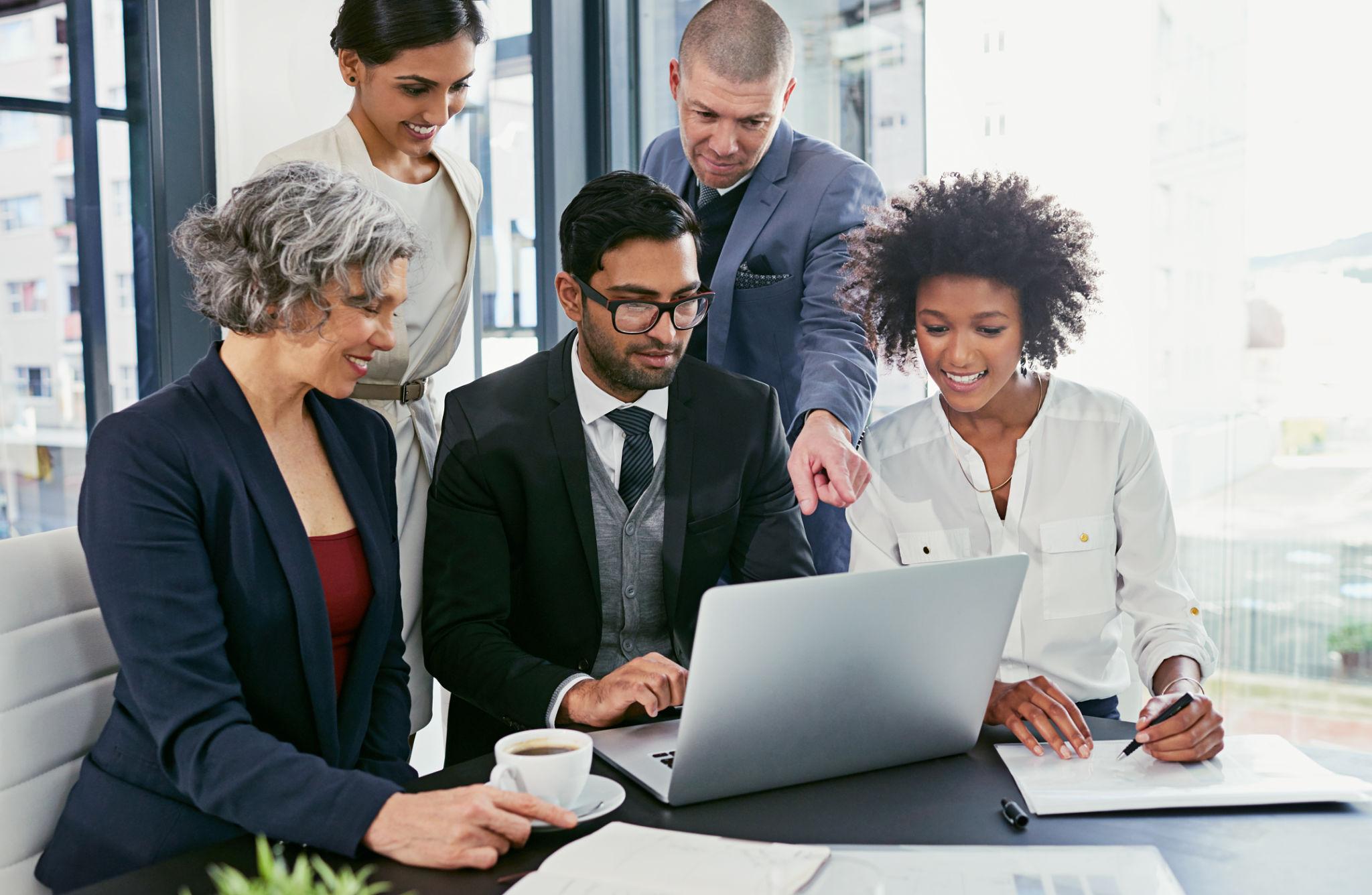 Professionals collaborating using business applications